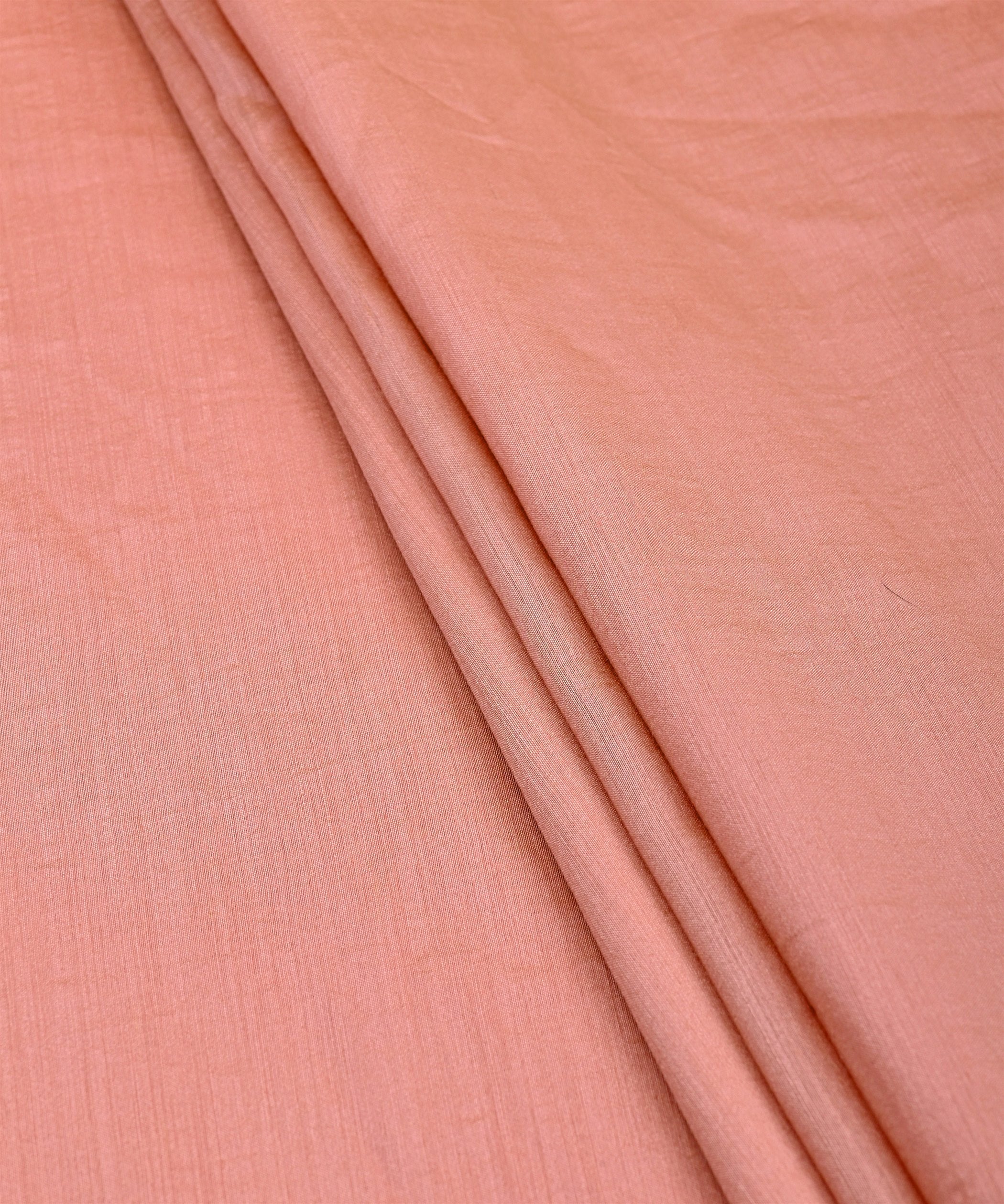 Buy Peach Plain Semi Muslin Fabric Online At Wholesale Prices