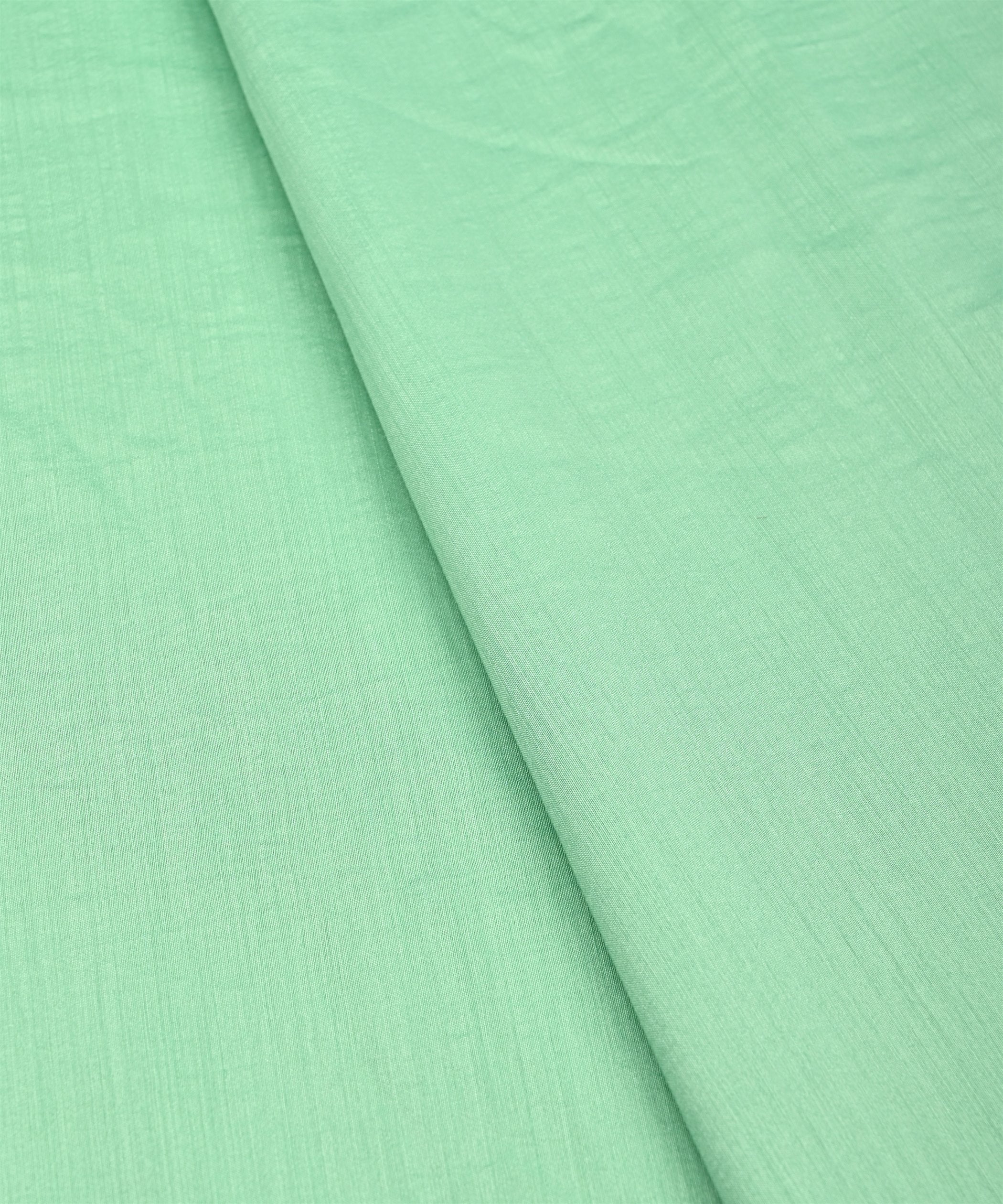 Sea Green Plain Dyed Semi Muslin Fabric
