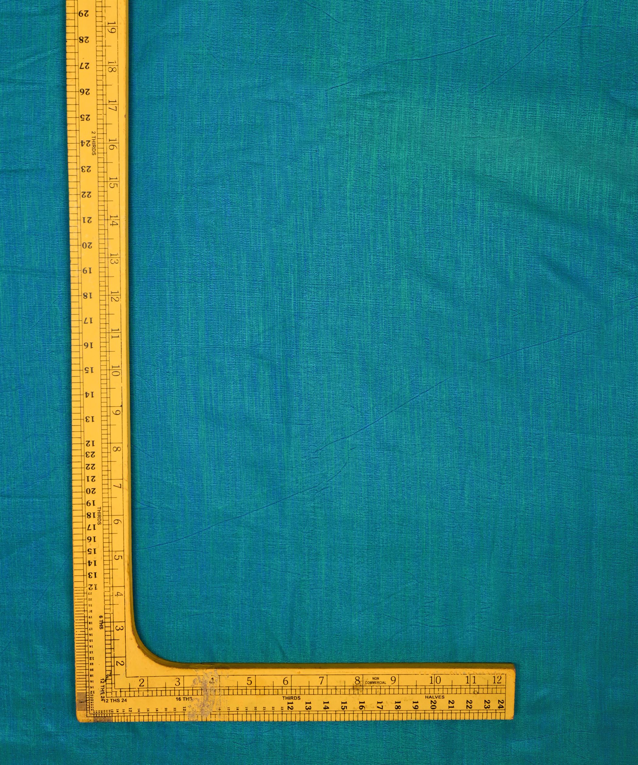 Peacock Blue Textured Semi Silk Fabric
